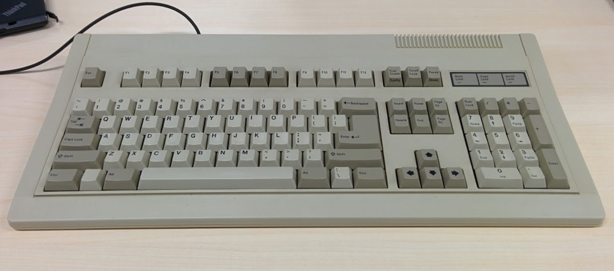 An image of the restored keyboard on a wood-finish desk.